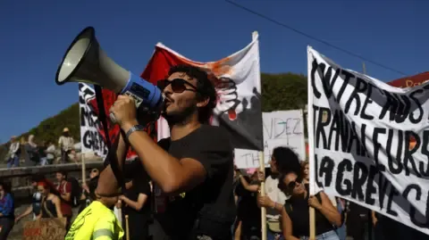 Nationwide Strikes Erupt Opposing Fiscal Slashing