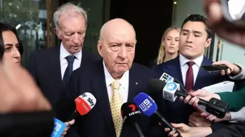Sex Abuse Allegations Against Prominent Down Under Broadcaster Downgraded